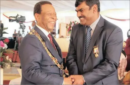 ??  ?? Ishwar Ramlutchma­n, right, with King Goodwill Zwelithini, who received special recognitio­n for building Indo-african race relations at last night’s Gopio event in umhlanga.