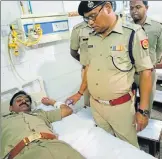  ?? HT PHOTO ?? Senior police official visiting an injured cop in the district hospital, Bahraich on Wednesday.