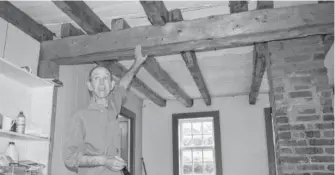  ?? DAVID JALA/CAPE BRETON POST ?? O’Brien House owner Jim MacDonald shows the ceiling beams of the late-18th century Sydney house he has put on the sales market. The structure, located on the Esplanade beside St. Patrick’s Church, has enjoyed a varied and storied past.