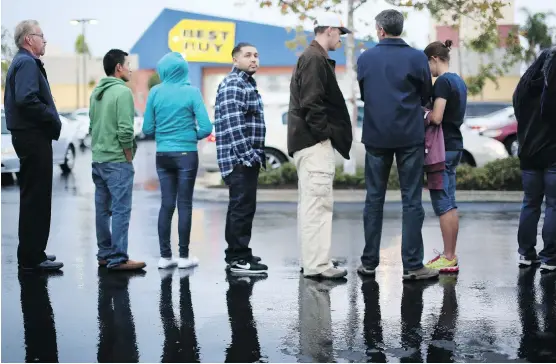  ?? SANDY HUFFAKER/GETTY IMAGES/FILES ?? Black Friday started gaining traction in Canada in 2009 when the loonie was close to parity with the U.S. dollar. Retailers, who were losing sales to U.S. stores, were forced to Canadianiz­e the shopping event. The strategy was a success as Canadians...