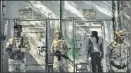  ?? The Washington Post/LORENZO TUGNOLI ?? Militiamen guard the entrance of the Najah school in Taiz, Yemen, which serves as Islamist warlord Abu al-Abbas’ militia headquarte­rs.