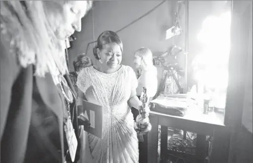  ?? By Robert Hanashiro, USA TODAY ?? Tears of joy: The Help’s Octavia Spencer composes herself backstage after winning for best supporting actress. “I don’t want to cry. I want to look pretty,” she said.