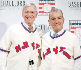  ?? (Photo by Alex Brandon, AP file) ?? Former commission­er Bud Selig, left, and Atlanta Braves president John Schuerholz pose with their Hall of Fame jerseys on, during a media availabili­ty at Major League Baseball’s winter meetings, in Oxon Hill, Md.