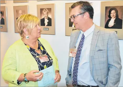  ?? RYAN ROSS/THE GUARDIAN ?? Former NHL player Theo Fleury, right, talks to Union of Public Sector Employees president Karen Jackson at the legislatur­e Thursday after a bill to amend the Employment Standards Act passed second reading. The bill would extend paid and unpaid leave to...