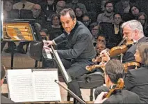  ?? RICHARD TERMINE/AP ?? Pianist Igor Levit plays with the Vienna Philharmon­ic Orchestra at Carnegie Hall in New York City on March 5.