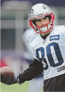  ?? STAFF PHOTO BY JOHN WILCOX ?? IN GOOD HANDS: Receiver Danny Amendola tosses the ball around at practice yesterday.