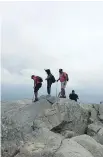  ??  ?? Hardy hikers have finally made it to the peak of Mount Monadnock.