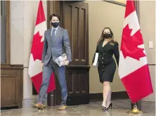  ?? JUSTIN TANG, THE CANADIAN PRESS ?? Prime Minister Justin Trudeau and Deputy Prime Minister Chrystia Freeland have both urged Canadians to limit contacts with family and friends over the holidays.