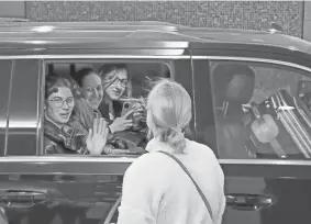  ?? BOBBY CAINA CALVAN/AP ?? Ukrainian students say goodbye on April 8 as they depart their hotel for the airport after spending almost a week taking part in the National Model United Nations Conference in New York.