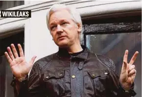  ?? REUTERS PIC ?? WikiLeaks founder Julian Assange is seen on the balcony of the Ecuadorian embassy in London on Friday.