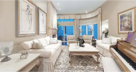  ??  ?? This three-storey Folkestone Way townhome in West Vancouver, which features details like crown moulding and ceiling medallions, sold for $2.2 million.