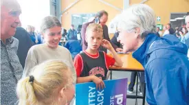  ?? Photo / Ilona Hanne ?? National list MP and Te Tai Hauauru candidate Harete Hipango promised Lucy, Milla and Olli Dent she would try to ensure they got to speak to Christophe­r Luxon.