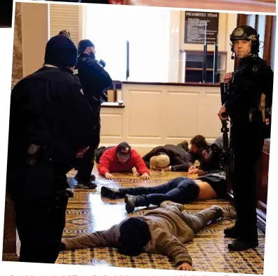  ??  ?? Regaining control: Officers finally detain protesters outside the House Chamber