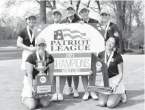  ?? NAVY ATHLETICS ?? Coach Nadia Ste-Marie, back row, center, and members of the Navy women’s golf team display the hardware earned from capturing their first Patriot League championsh­ip.