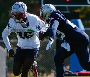  ?? MATTHEW J. LEE/GLOBE STAFF ?? Cornerback J.C. Jackson (right) totaled 17 intercepti­ons and 37 passes defensed for the Patriots in the 2020 and ’21 seasons.