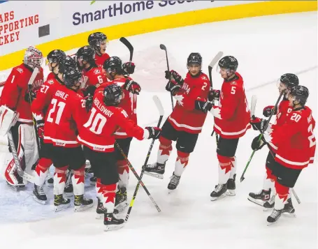  ?? JASON FRANSON/THE CANADIAN PRESS FILES ?? Canada celebrates the win over Russia at the IIHF World Junior Hockey Championsh­ip in Edmonton in 2021. With Russia out as host for the 2023 event due to its invasion of Ukraine, the tourney will be held in Canada, and cities are lining up with bids.