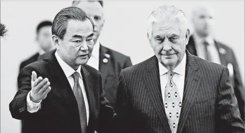  ?? LINTAO ZHANG/GETTY ?? Chinese Foreign Minister Wang Yi, left, and U.S. Secretary of State Rex Tillerson met Saturday in Beijing.