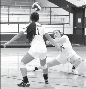  ?? Westside Eagle Observer/MIKE ECKELS ?? With Kaylee Morales waiting to assist if needed, Brownyn Berry (right) pops the ball toward the net during the third set of the Decatur-Alpena varsity girls volleyball match in Decatur on Aug. 23. MIKE ECKELS meckels@nwadg.com