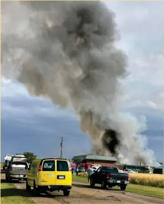  ?? Photo courtesy of Village of Stewart Valley ?? Dark smoke rises into the air from the fire at the Stewart Valley school building and community centre, Aug. 26.