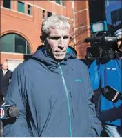  ?? Scott Eisen Getty Images/TNS ?? WILLIAM “RICK” SINGER, the scheme’s mastermind, exits federal court on March 12 in Boston.