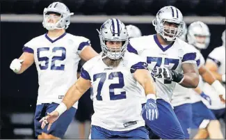 ?? [AP PHOTO/ TONY GUTIERREZ] ?? In this June 11 photo, Dallas Cowboys' Travis Frederick (72), Connor Williams (52) and Tyron Smith (77) warm up at the team's NFL football training facility in Frisco, Texas.