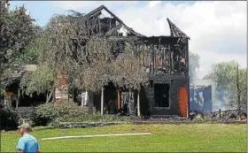  ?? MARIAN DENNIS — DIGITAL FIRST MEDIA ?? Limerick/Linfield fire companies at the scene of a serious fire on Gristmill Lane.