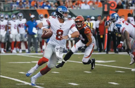  ??  ?? Frank Victores New York Giants quarterbac­k Daniel Jones looks to pass on the run during the first half of the team’s NFL preseason football game against the Cincinnati Bengals, Thursday, Aug. 22, 2019, in Cincinnati.