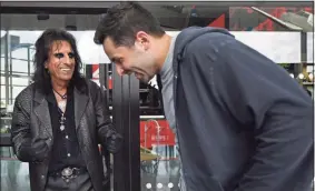  ?? David Dermer / Associated Press ?? Singer Alice Cooper, left, and Cleveland Browns quarterbac­k Baker Mayfield laugh during a Progressiv­e Insurance commercial shoot at the Rock and Roll Hall of Fame in Cleveland.