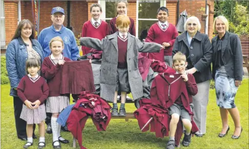  ?? Picture: Martin Apps FM2599417 ?? CHILDREN’S GIFTS: Old Shernold School uniforms are donated to the Chernobyl Children’s Life Line