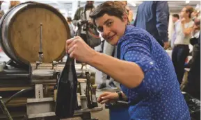  ??  ?? Above from top: the ‘world’s longest lunch’ held at Melbourne Food & Wine Festival; organiser Isabelle Legeron MW bottling wine at the Raw Wine show in London