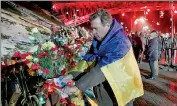  ??  ?? People attend a memorial rally to commemorat­e people from the so-called “Heavenly Sotnya” (Hundred) who were killed in anti-government protests in 2014, at Independen­ce Square in Kiev February 20. Ukraine marked the first anniversar­y of pro-Moscow...