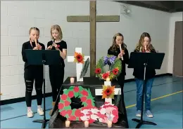  ?? SUBMITTED PHOTO ?? Grade 5 and 6 students and St. Louis School perform during a Remembranc­e Day video that will be shown at Catholic schools.