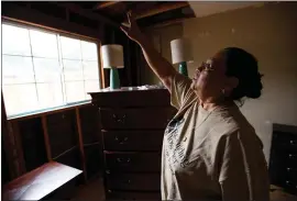  ?? RANDY VAZQUEZ — STAFF PHOTOGRAPH­ER ?? Vianey Villegas points to an area in her San Jose home that developed mold. Villegas received assistance from Rebuilding Together Silicon Valley, an organizati­on that helps low-income homeowners make interior and exterior home repairs.