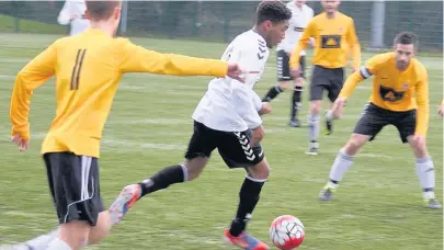  ??  ?? ●●Action from Signol Athletic’s game against Moorside Rangers (in yellow)