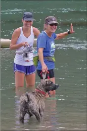  ??  ?? Gail Leland with daughter Shelby cooling off in Big River after a run. Shelby helped Gail discover the joy of running and racing.