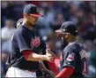  ?? RON SCHWANE — THE ASSOCIATED PRESS ?? Indians starting pitcher Carlos Carrasco gets congratula­ted by Carlos Santana before being pulled from the game against the Twins during the ninth inning.