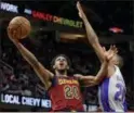  ?? TONY DEJAK — THE ASSOCIATED PRESS ?? Brandon Knight, left, drives against the Pistons’ Wayne Ellington during the first half March 2.