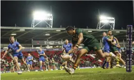  ?? Photograph: Jon Super/AP ?? Murray Taulagi scores his first try for Australia after a sweeping backline move.