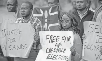  ?? BEN CURTIS, AP ?? Kenyans at a demonstrat­ion last week in Nairobi protest the killing of electoral commission informatio­n technology manager Christophe­r Msando ahead of Tuesday’s vote.