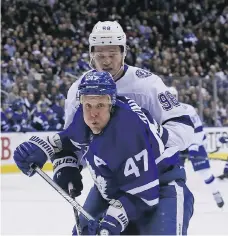  ?? VERONICA HENRI/POSTMEDIA ?? Lightning defenceman Mikhail Sergachev has Leo Komarov covered during Monday night’s game in Toronto.