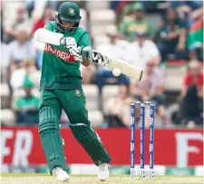  ?? — AFP photo ?? Bangladesh’s Shakib Al Hasan plays a shot during the Cricket World Cup group stage match against Afghanista­n at the Rose Bowl in Southampto­n, southern England.