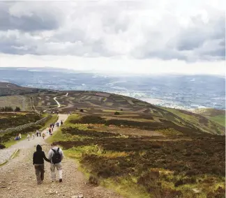  ??  ?? TOP LEFT In 2017, archaeolog­ists found 4,000-year-old stone tools on Penycloddi­au’s summit RIGHT Moel Famau is the highest hill in the Clwydians BOTTOM LEFT The Dinorben Arms in Bodfari is a popular overnight stop for Offa’s Dyke walkers on the last day of their south-to-north journey