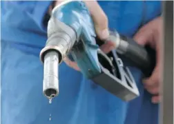  ?? GENT SHKULLAKU/ AFP/ GETTY IMAGES FILES ?? To get the lead out of gasoline at the pumps, we didn’t ‘ put a price on lead’ but rather used product standard regulation.