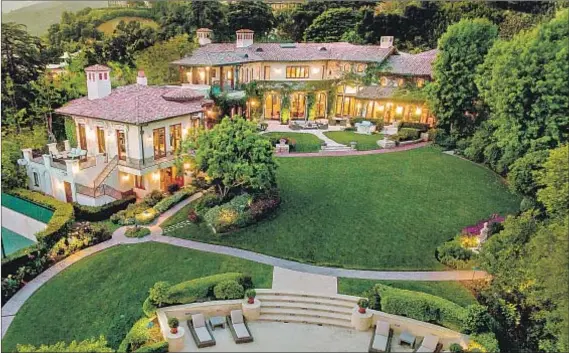  ?? Photograph­s by Adam Latham ?? LISTED FOR $51.995 million, Sugar Ray Leonard’s Pacific Palisades mansion weighs in among L.A. County’s priciest homes.