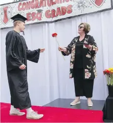  ?? DARREN STONE, TIMES COLONIST ?? Esquimalt High grad Ryan Boothroyd and principal Tina Pierik.