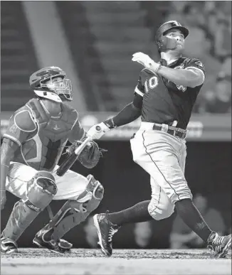  ?? SEAN M. HAFFEY Getty Images ?? CHICAGO’S YOAN MONCADA connects for a solo home run in the seventh inning, giving the White Sox a 3-0 lead. Angels catcher Martin Maldonado can only watch the ball fly.