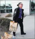  ??  ?? TSA officer Amy Jones carries donated items to her car Wednesday.