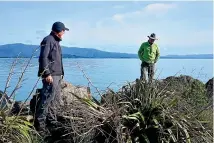  ??  ?? Penguin expert Professor John Cockrem, left, and Department of Conservati­on ranger Mike Ogle visit the little blue penguin nesting site at Port Tarakohe. Cockrem says the port’s planned redevelopm­ent is a ‘‘huge opportunit­y’’ to create a special area for the birds.