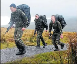  ??  ?? Soldiers are put through tough training in the Brecon Beacons