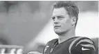  ?? SAM GREENE/THE ENQUIRER ?? Bengals quarterbac­k Joe Burrow was taken No. 1 in the 2020 NFL draft, four picks ahead of Dolphins signal caller Tua Tagavoila.